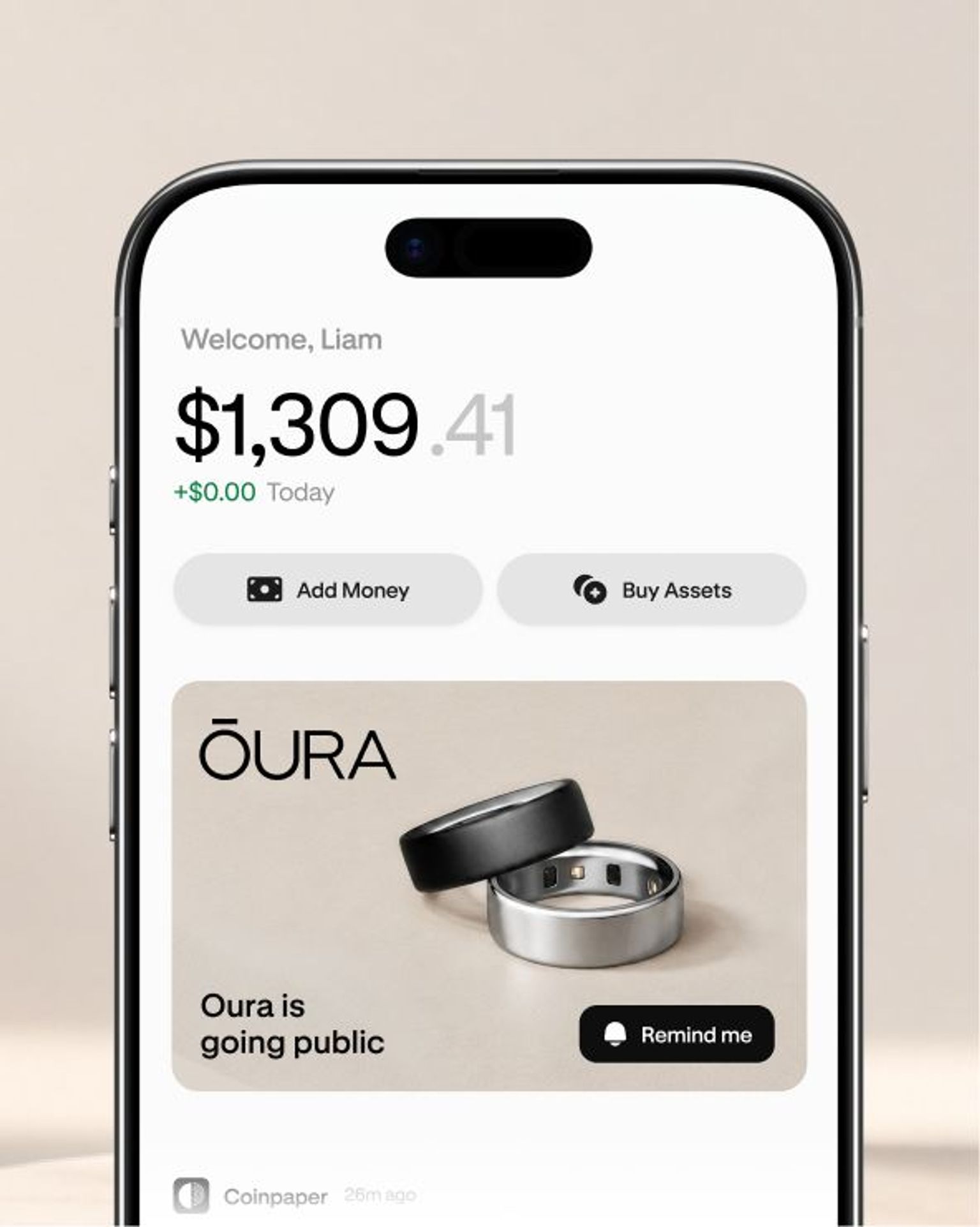 Smartphone screen showing a finance app with balance and Oura ring ad.
