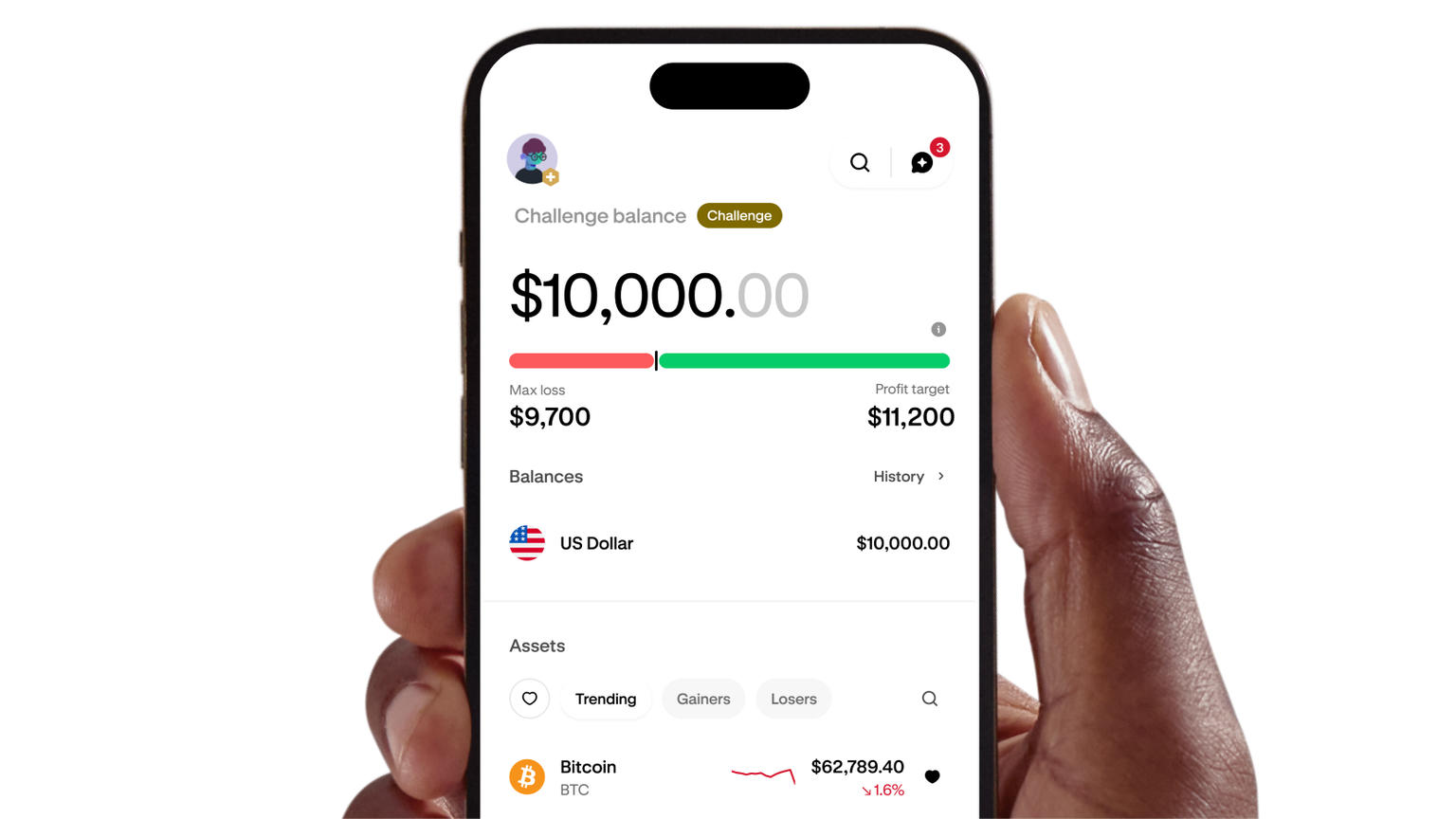 Hand holding a phone displaying a funded trading account dashboard